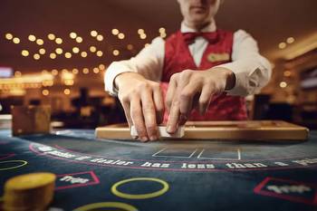What is a play-through requirement or rollover at online casinos?