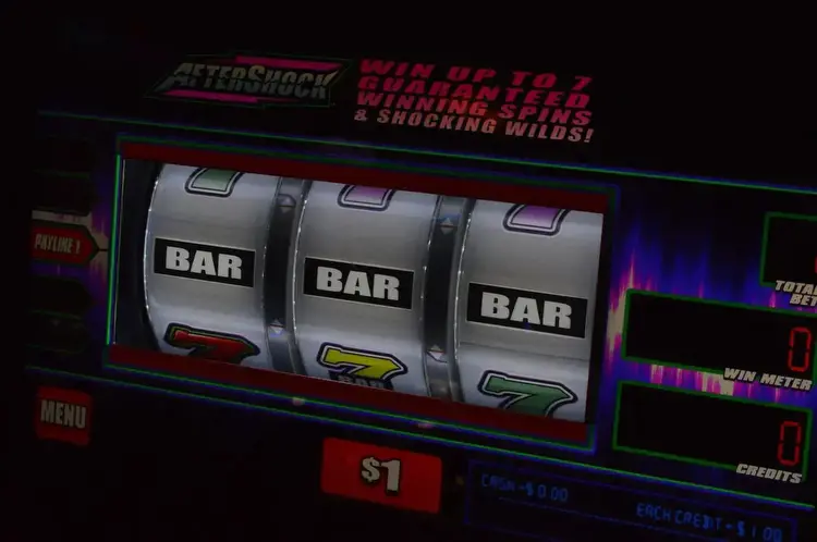 Michigan investigators seize slot machines and cash in illegal gambling raid