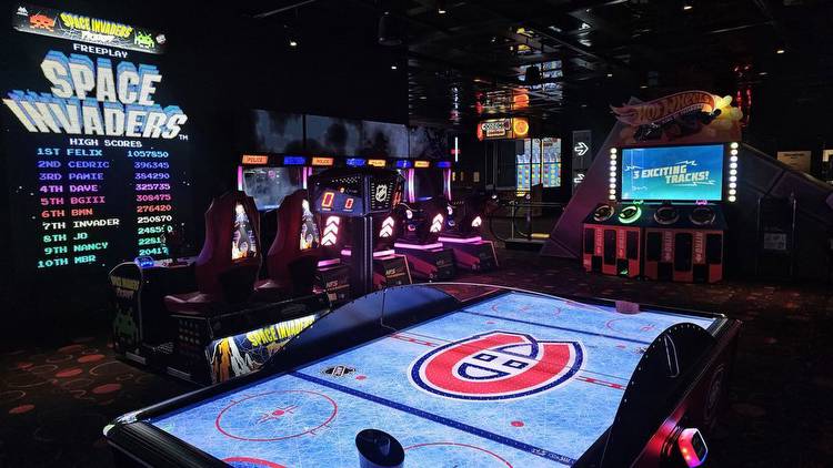 A Habs-themed air hockey table with Space Invaders and Need for Speed in the background.